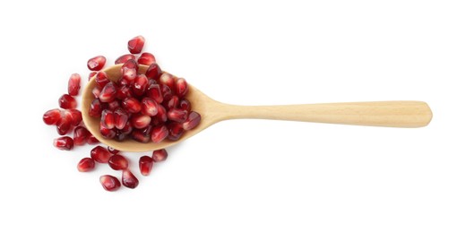 Ripe juicy pomegranate grains in wooden spoon isolated on white, top view