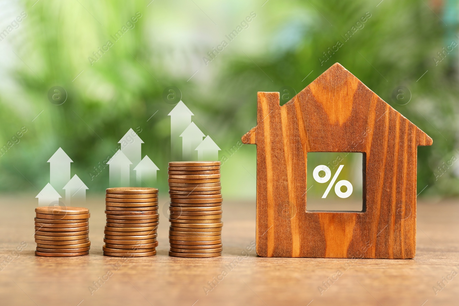 Image of Mortgage rate. Stacked coins, arrows, percent sign and wooden model of house