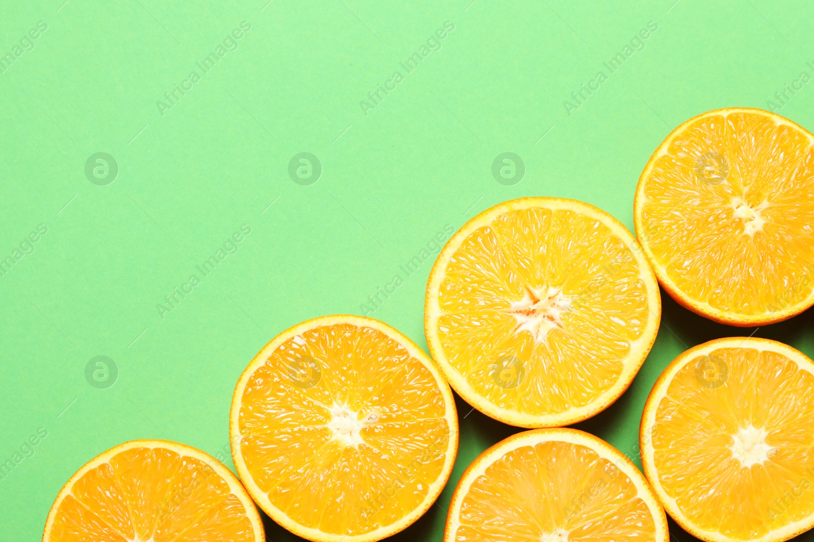 Photo of Flat lay composition with ripe oranges and space for text on color background