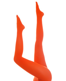 Photo of Woman wearing terracotta tights on white background, closeup of legs