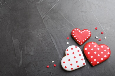 Photo of Valentine's day cookies on grey table, flat lay. Space for text