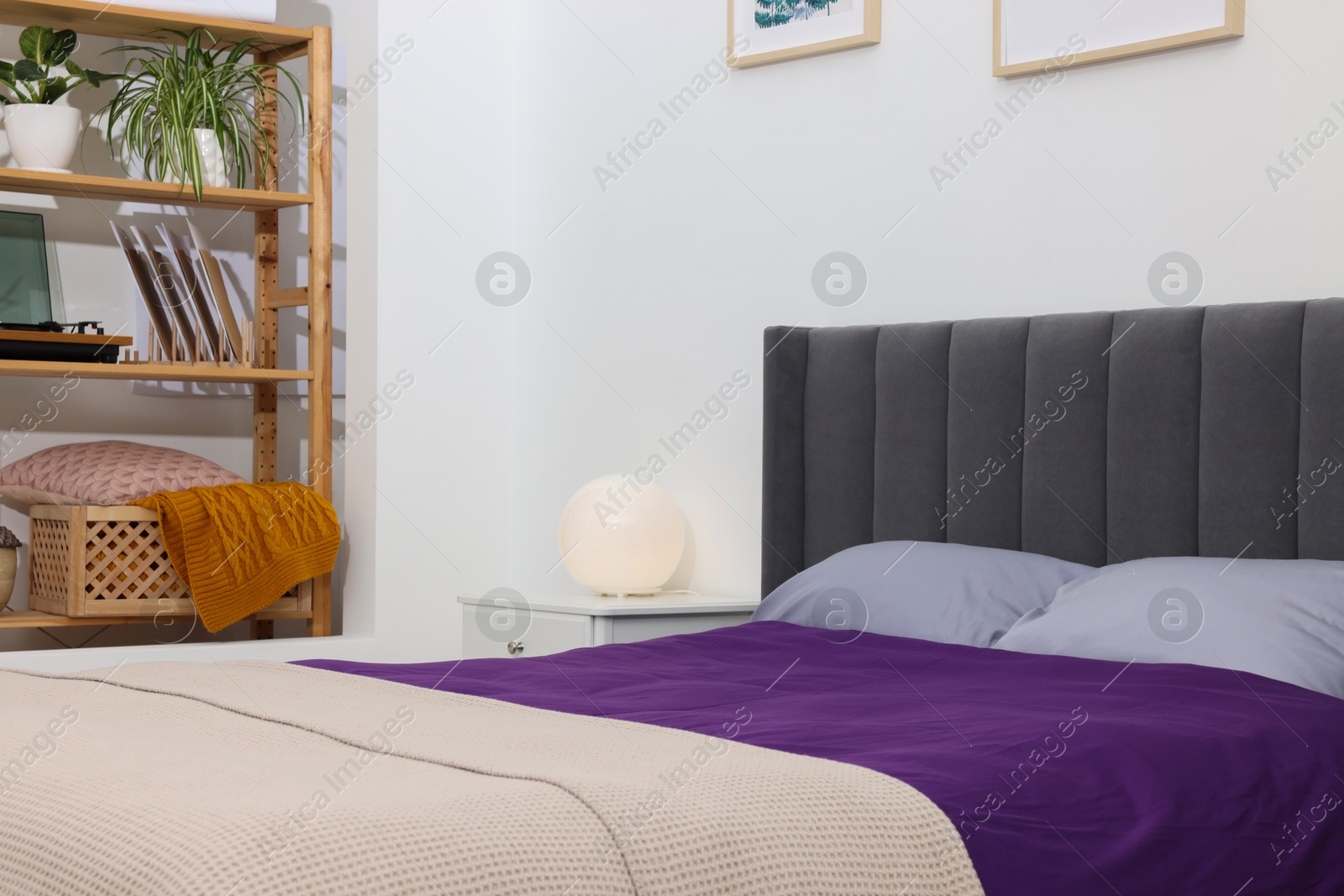 Photo of Comfortable bed and different decor in bedroom. Interior design