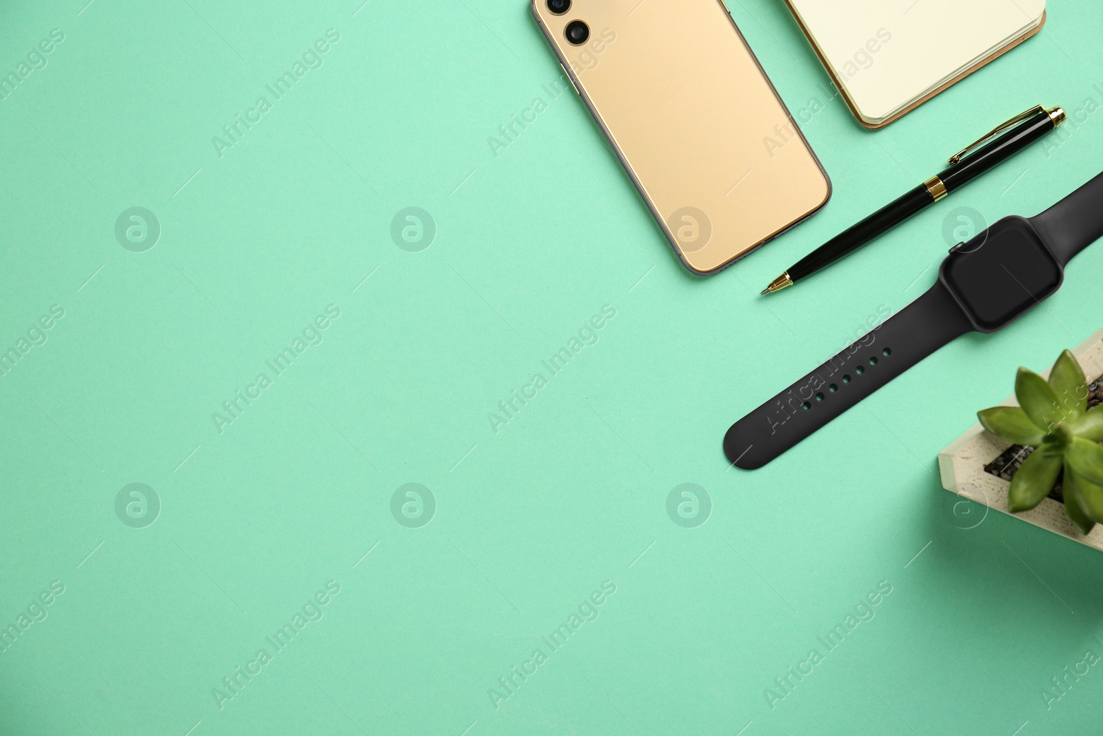 Flat lay composition with stylish smart watch on turquoise background. Space for text Photo of Flat lay composition with stylish smart watch on turquoise background. Space for text