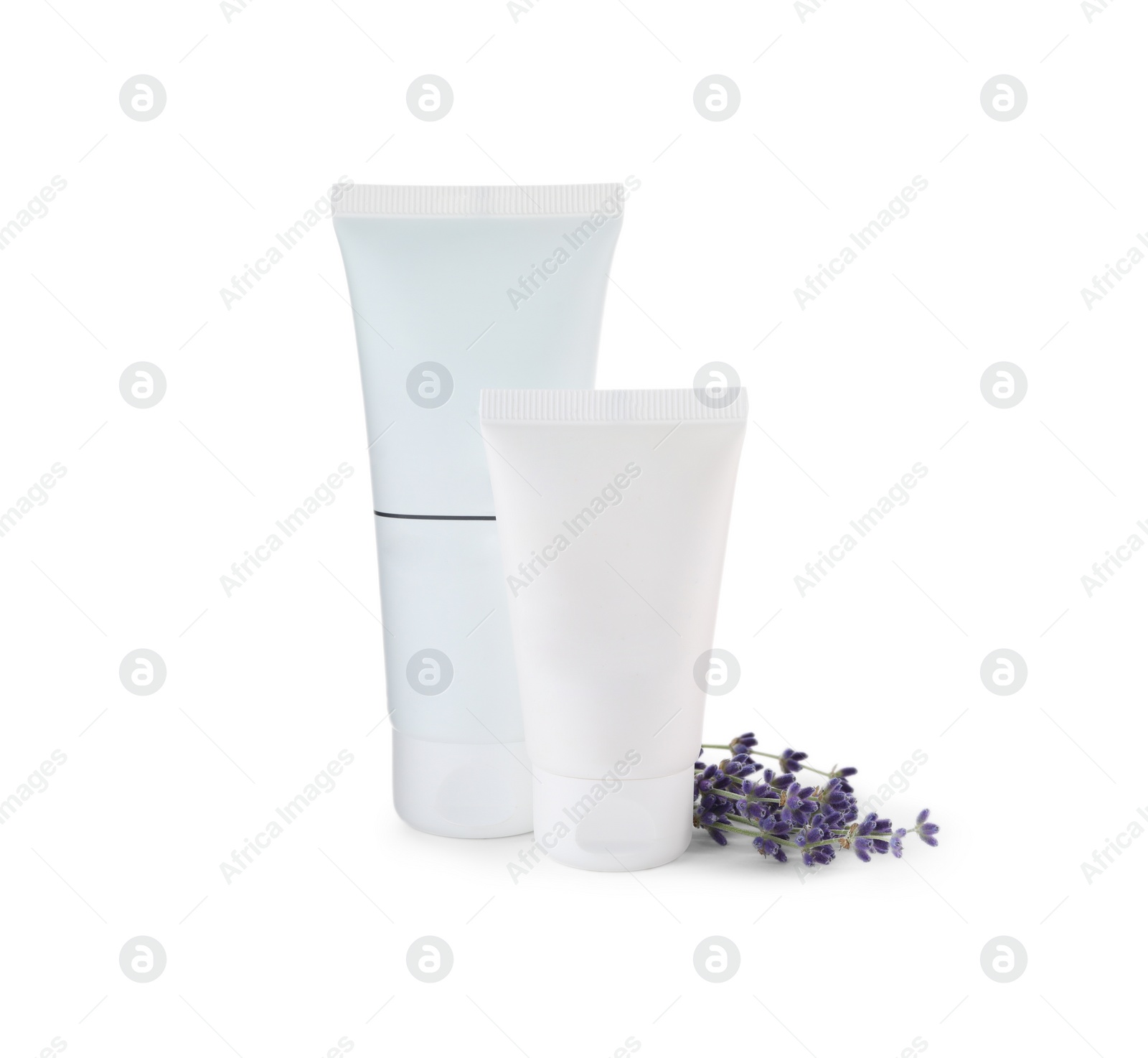 Photo of Tubes of hand cream and lavender on white isolated