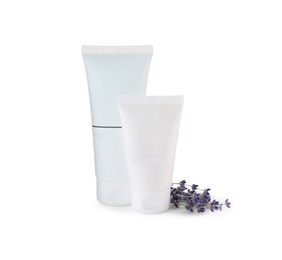 Photo of Tubes of hand cream and lavender on white isolated