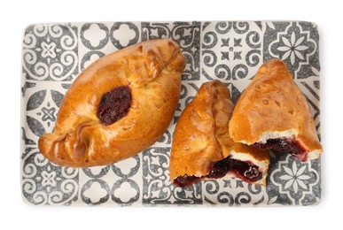 Photo of Delicious baked patties with cherry on white background, top view