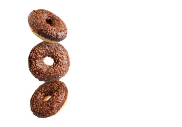 Image of Tasty chocolate donuts with sprinkles on white background