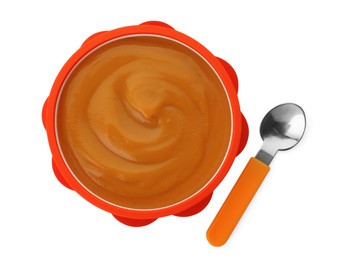 Photo of Bowl of tasty pureed baby food and spoon isolated on white, top view
