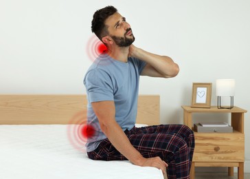 Man suffering from neck pain after sleeping on uncomfortable mattress at home