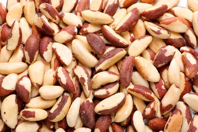 Many delicious Brazil nuts as background, top view