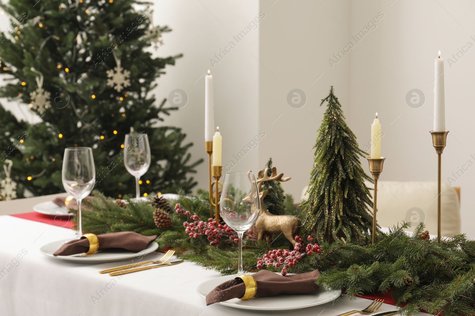 Photo of Beautiful table setting with Christmas decor indoors