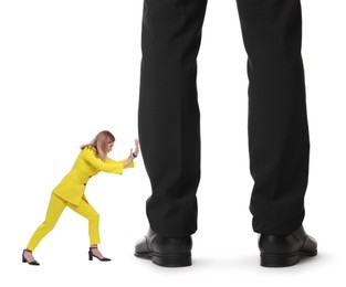 Image of Small woman pushing giant man on white background