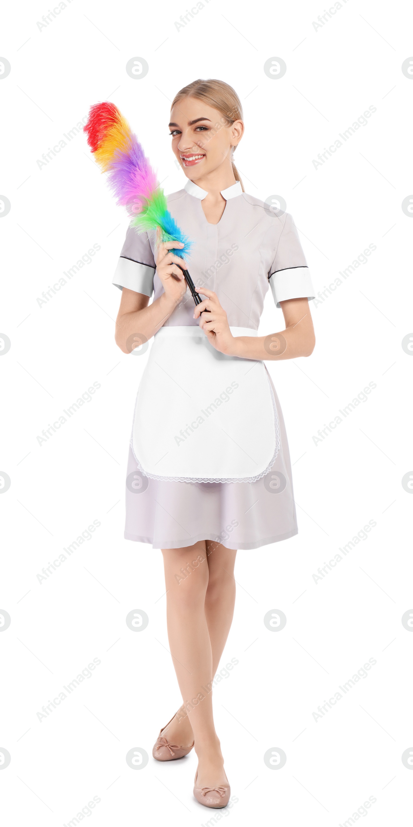 Photo of Young chambermaid with dusting brush on white background