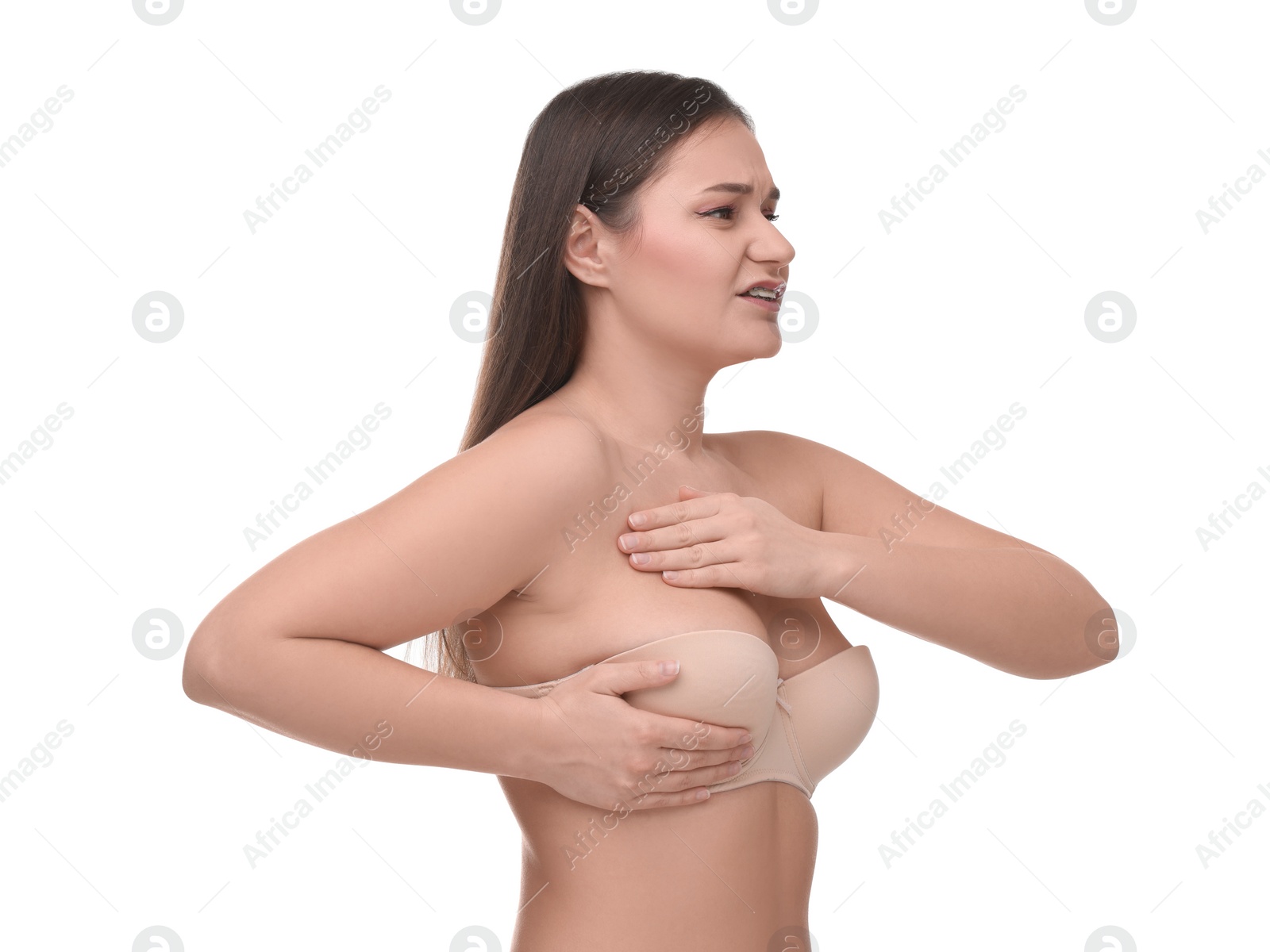 Photo of Mammology. Woman in bra doing breast self-examination on white background