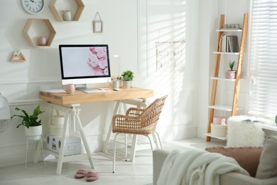 Stylish home office interior with comfortable workplace