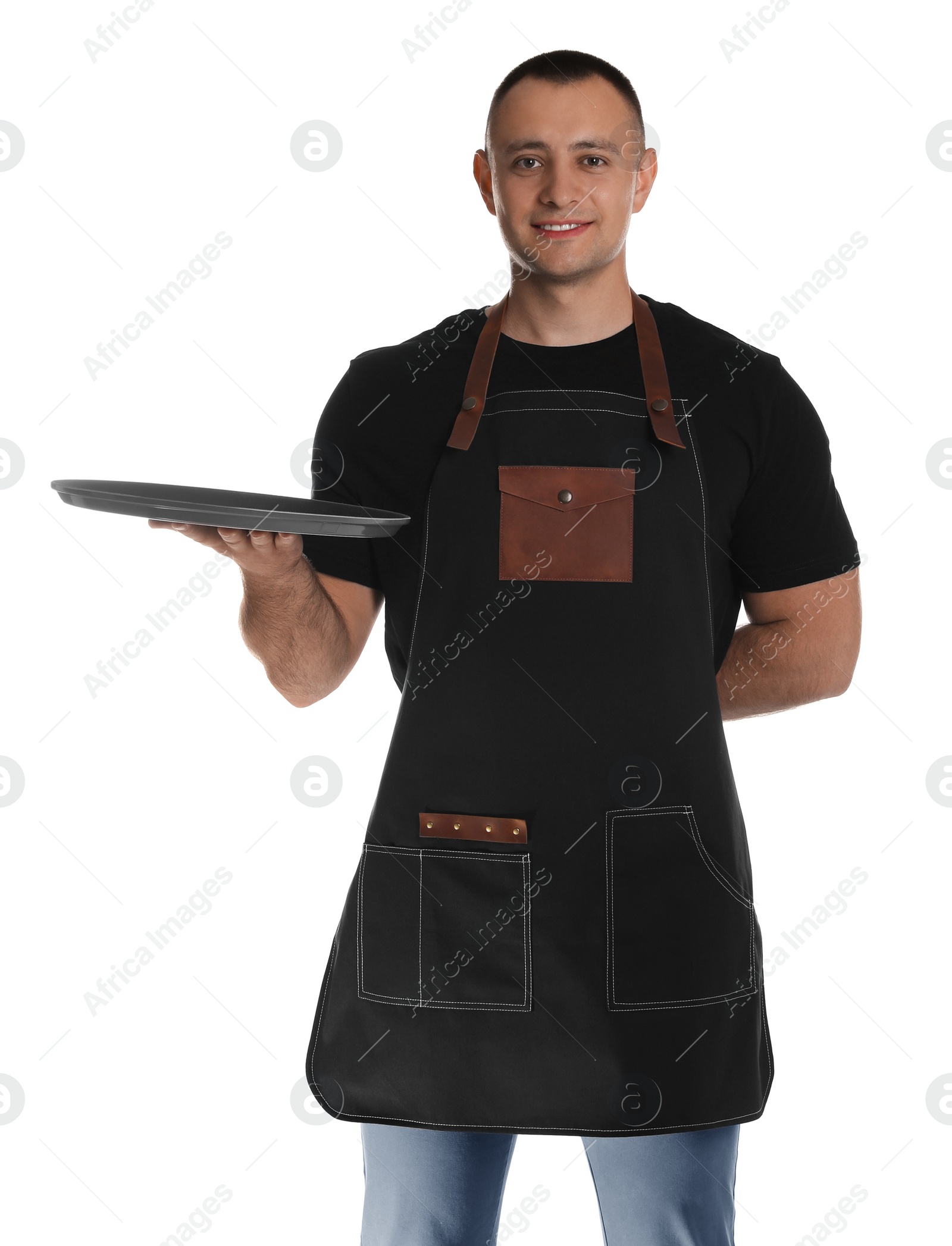 Photo of Portrait of happy young waiter with tray on white background