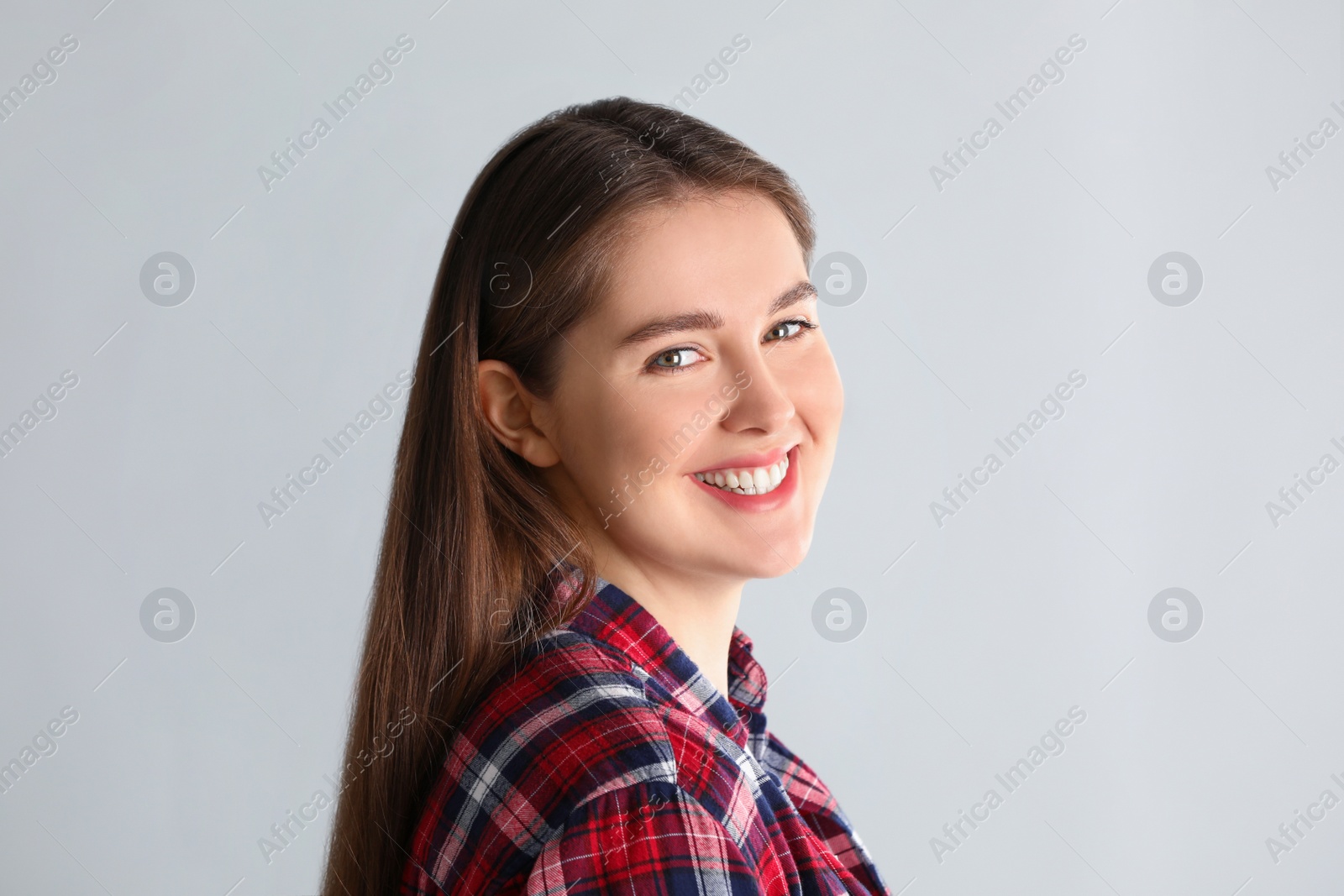 Photo of Portrait of young woman on light background