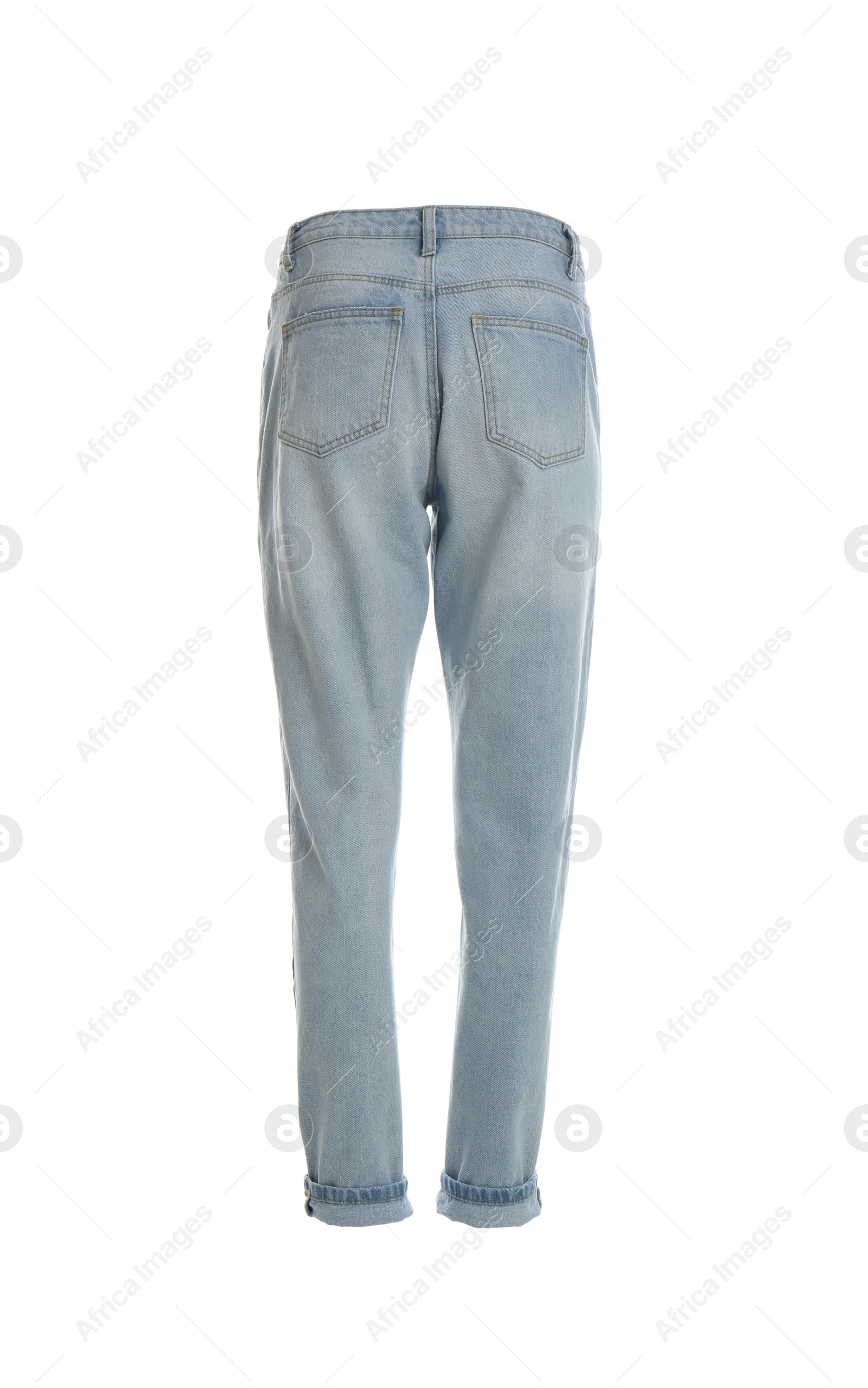 Photo of Stylish jeans on mannequin against white background, back view. Women's clothes