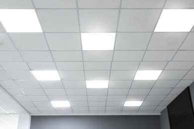 Photo of White ceiling with lighting in office room