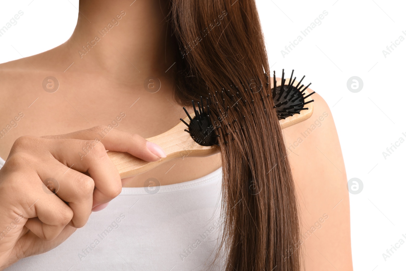 Photo of Woman with hair brush on white background, closeup