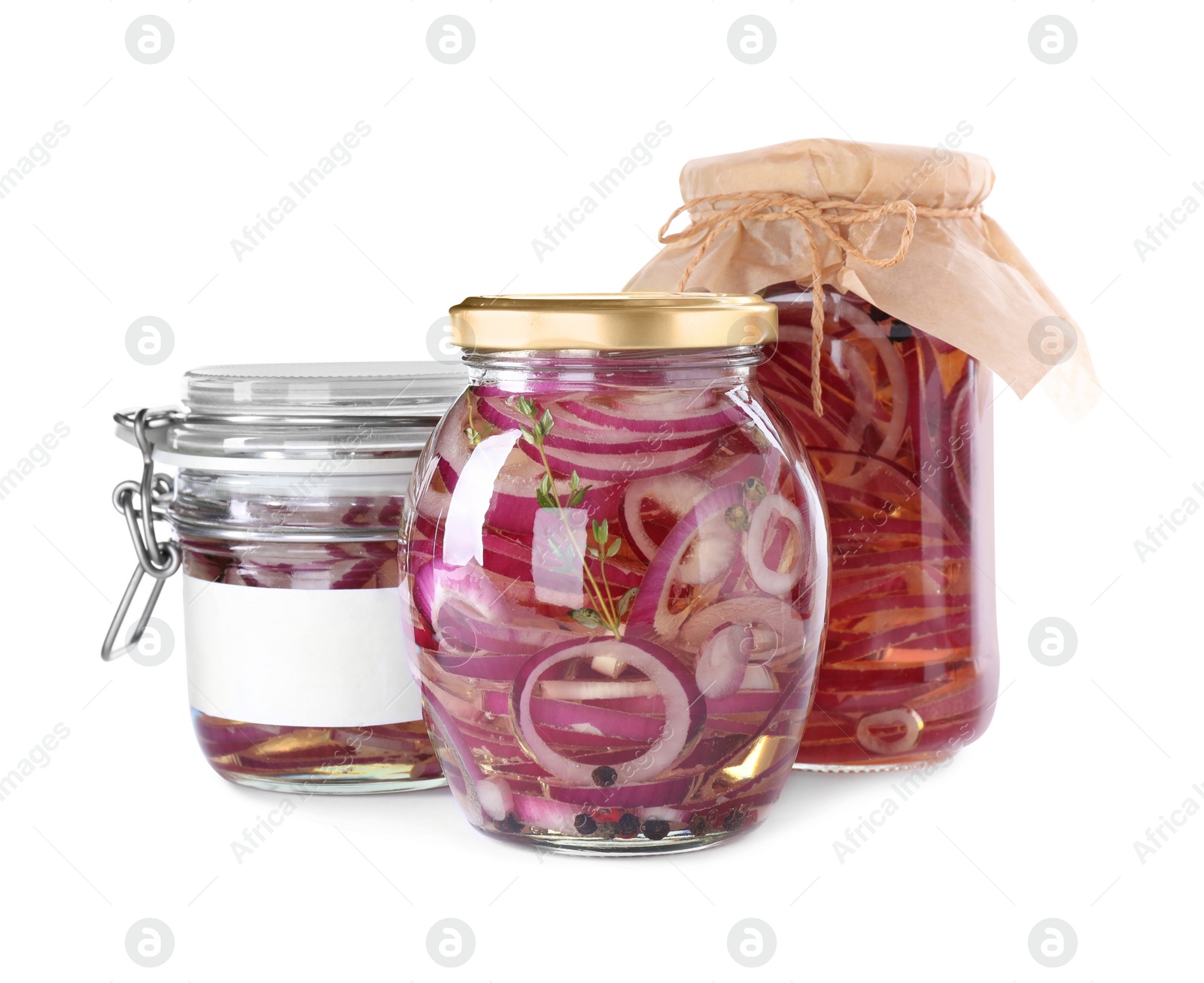 Photo of Jars of pickled onions isolated on white