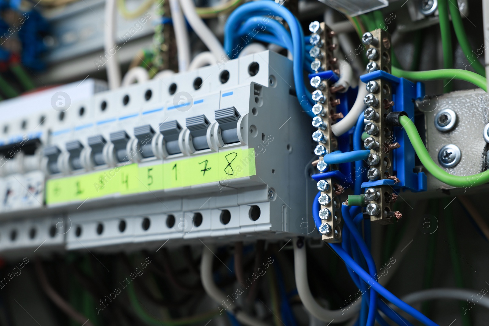 Photo of Electrical panel with many wires in fuse box, closeup