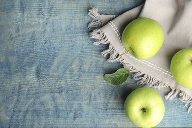 Photo of Flat lay composition of fresh ripe green apples on wooden table, space for text