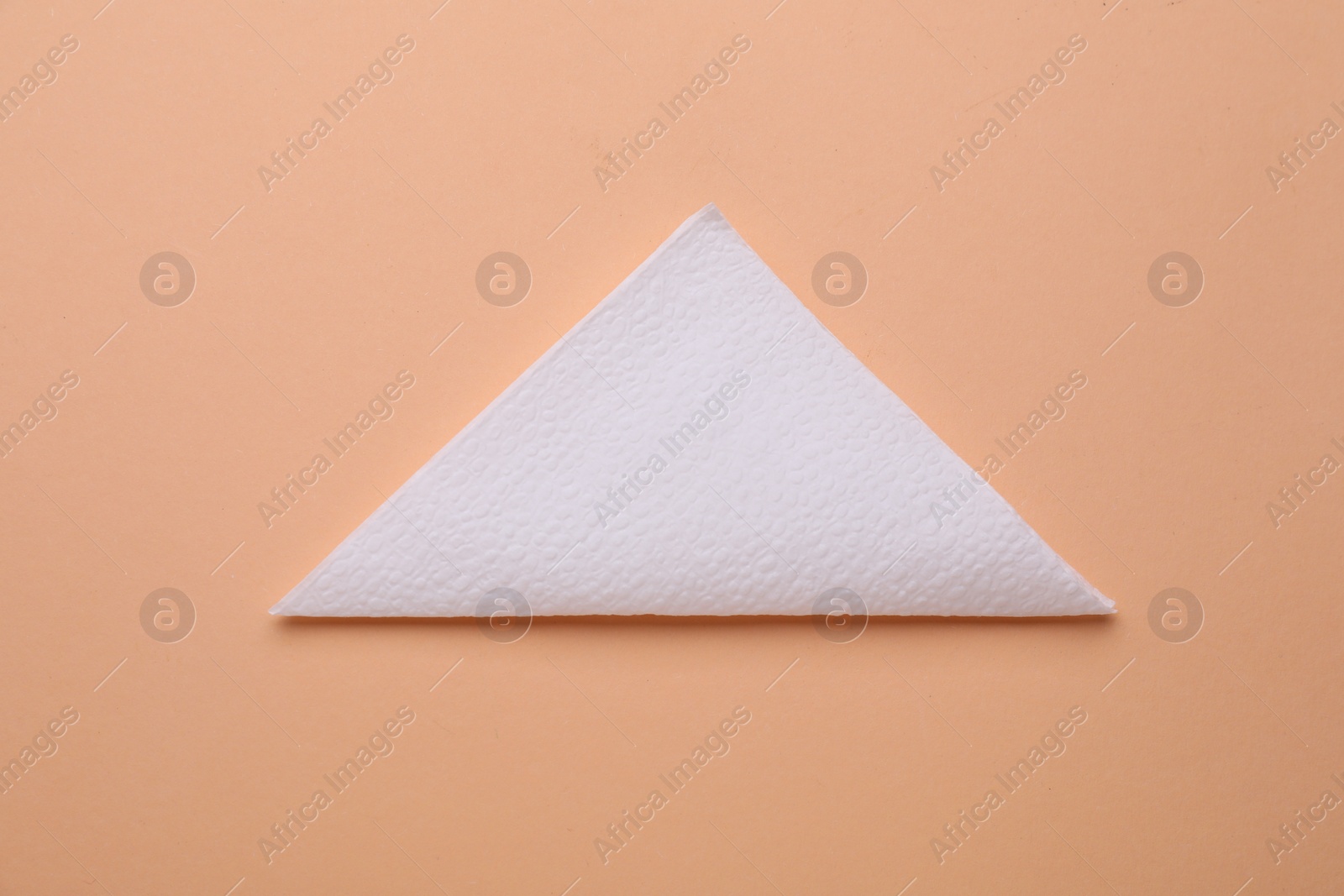 Photo of Clean paper tissue on beige background, top view