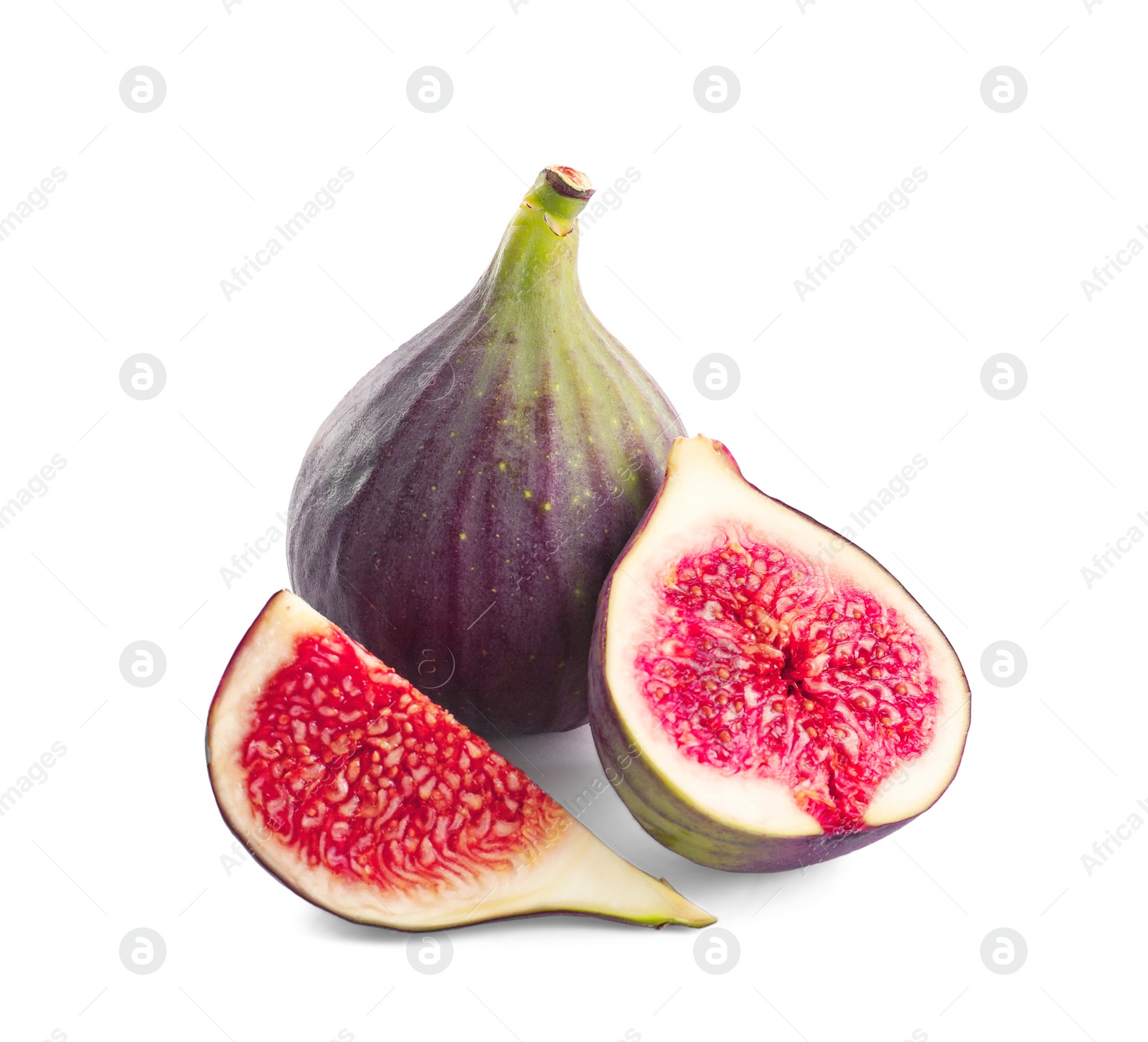 Photo of Whole and cut purple figs on white background