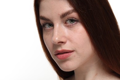 Portrait of beautiful woman with freckles on white background, closeup