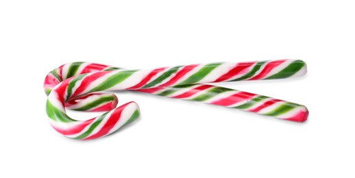 Sweet Christmas candy canes on white background