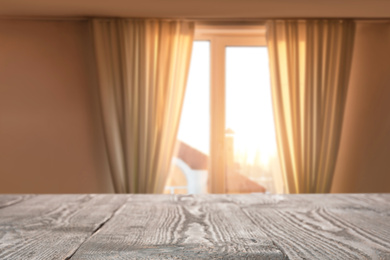 Image of Empty wooden table in room. Space for design