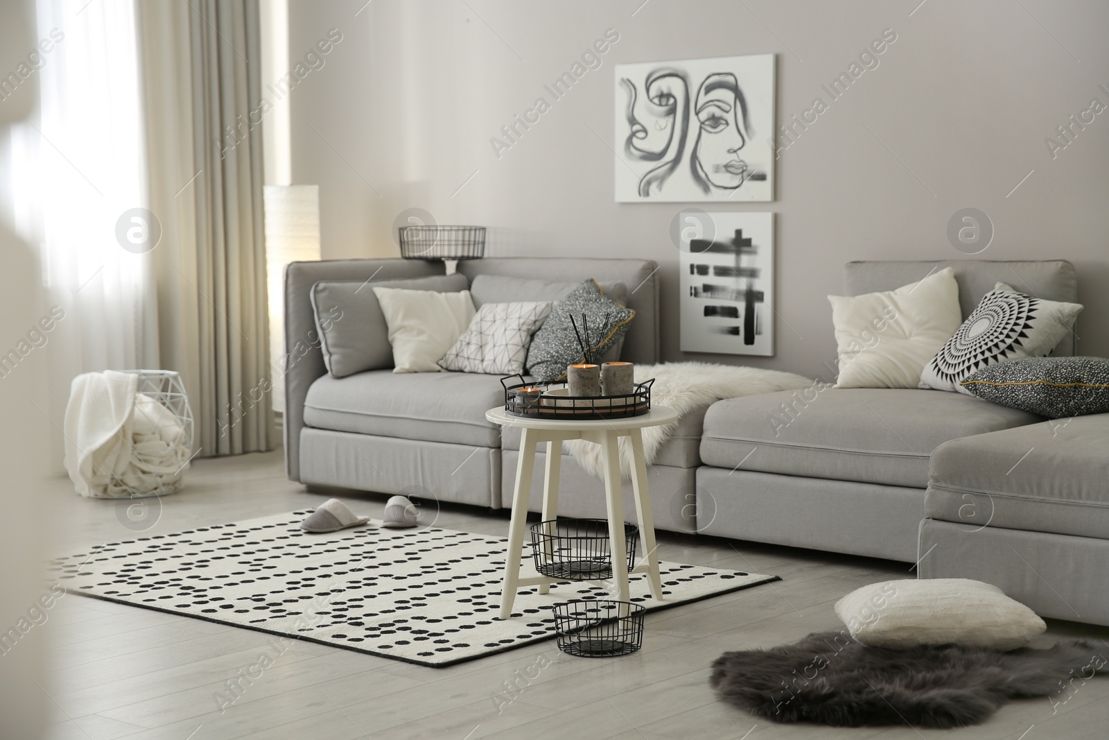 Photo of Cozy living room interior with big grey sofa