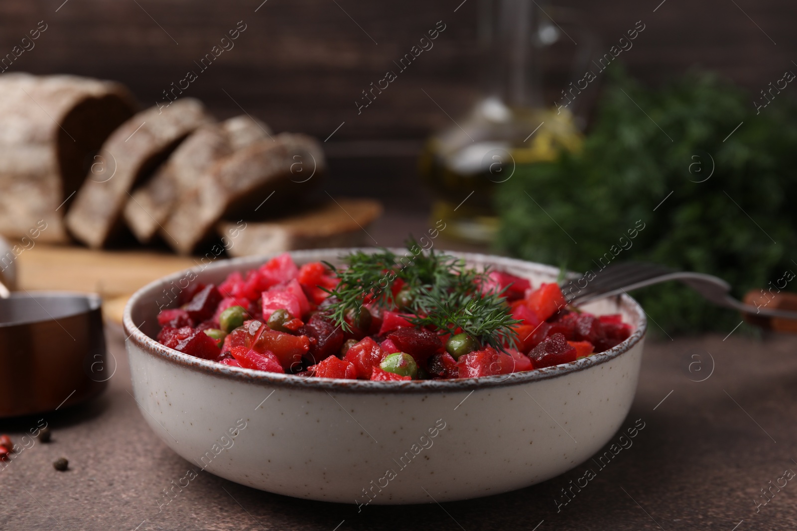 Photo of Delicious fresh vinaigrette salad on grey table, closeup