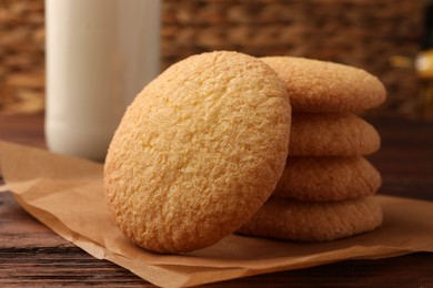 Photo of Delicious Danish butter cookies on wooden table, closeup