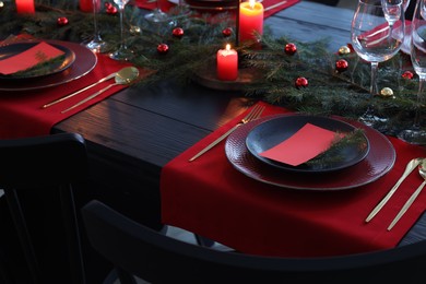 Elegant Christmas table setting with blank place cards and festive decor