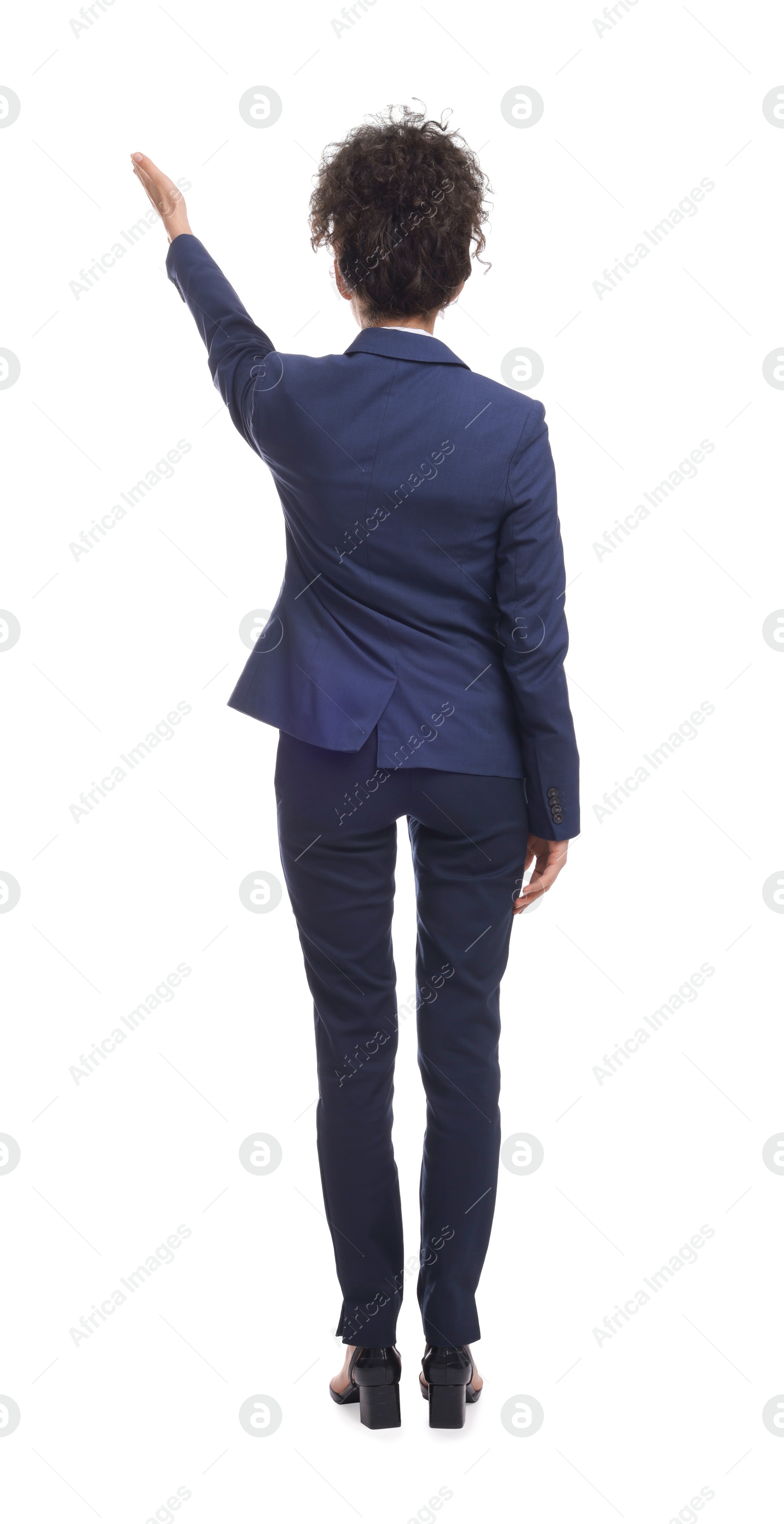 Photo of Businesswoman in suit pointing at something on white background, back view