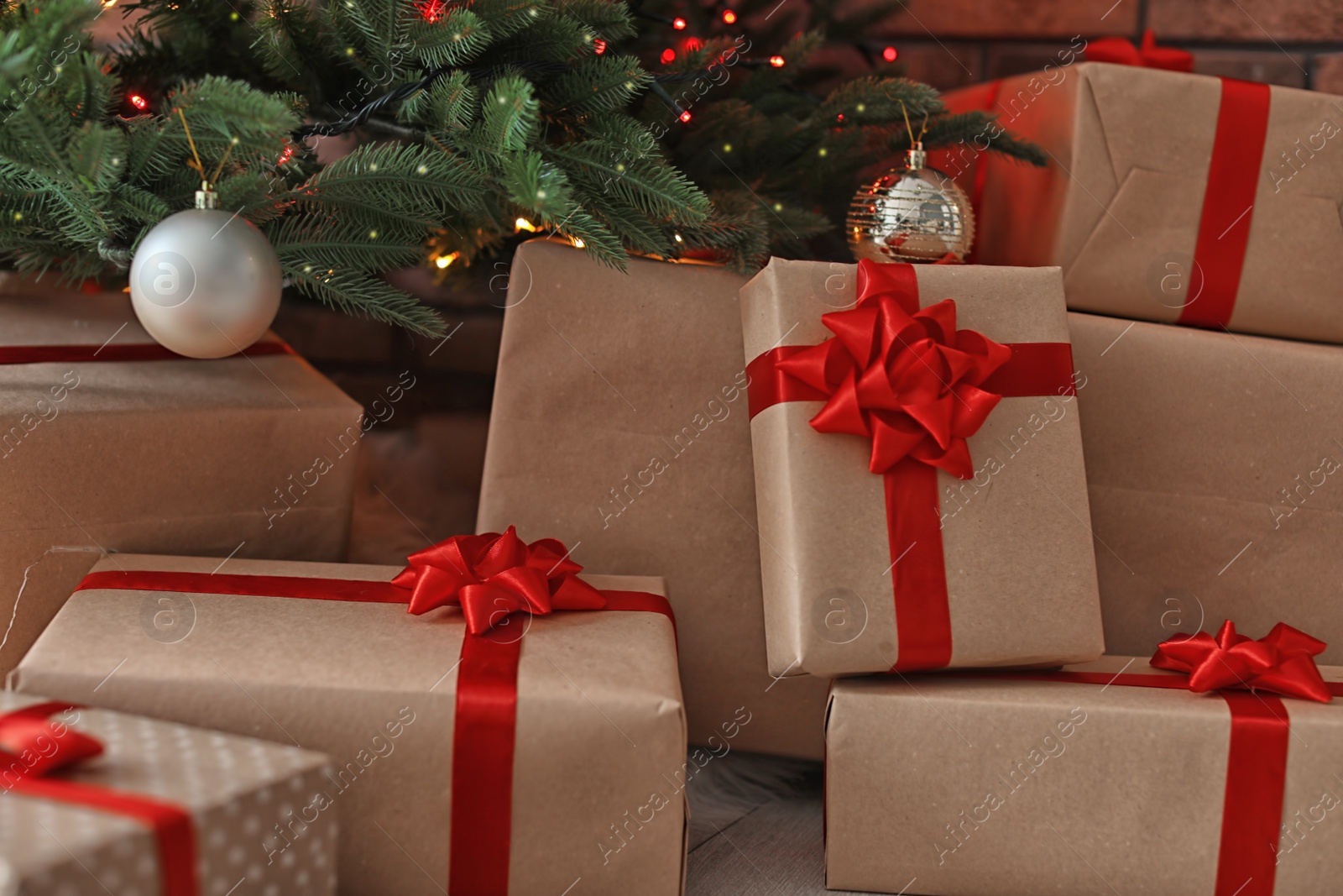 Photo of Beautiful Christmas tree and gift boxes, closeup