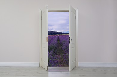 Open door in white wall inviting to visit lavender field