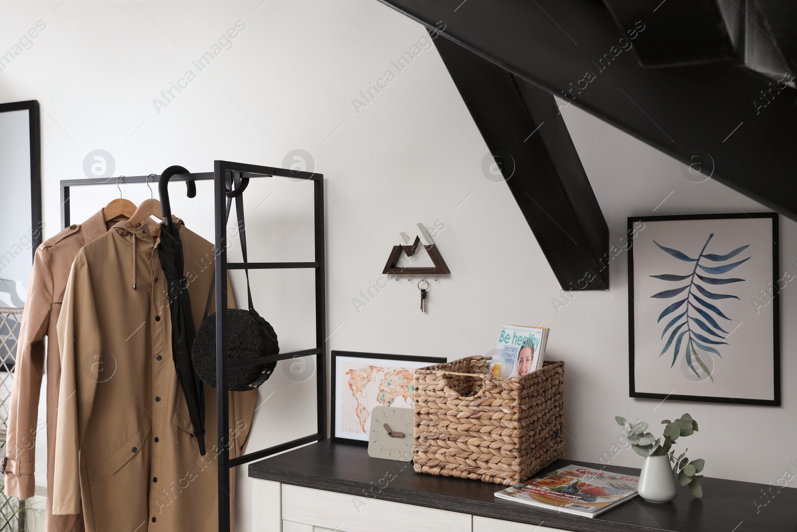 Photo of Modern hallway interior with stylish furniture and key holder