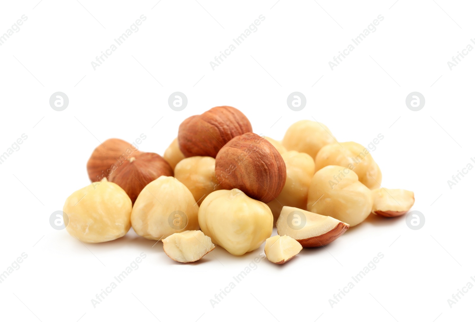 Photo of Heap of tasty hazelnuts on white background