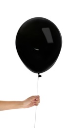 Woman holding black balloon on white background. Halloween party