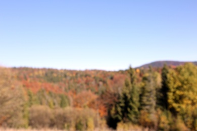 Photo of Picturesque landscape with blue sky over mountains, blurred view