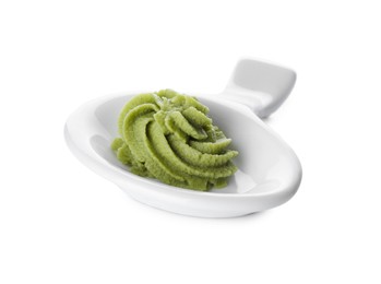 Photo of Plate with swirl of wasabi paste isolated on white