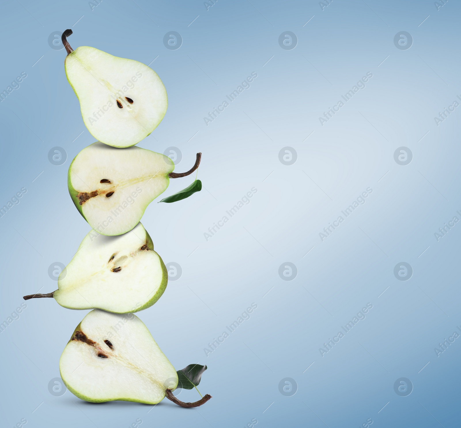 Image of Cut fresh ripe pears on light blue gradient background, space for text