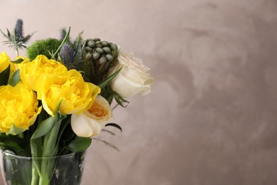 Photo of Beautiful bouquet with peony tulips against grey background, closeup. Space for text
