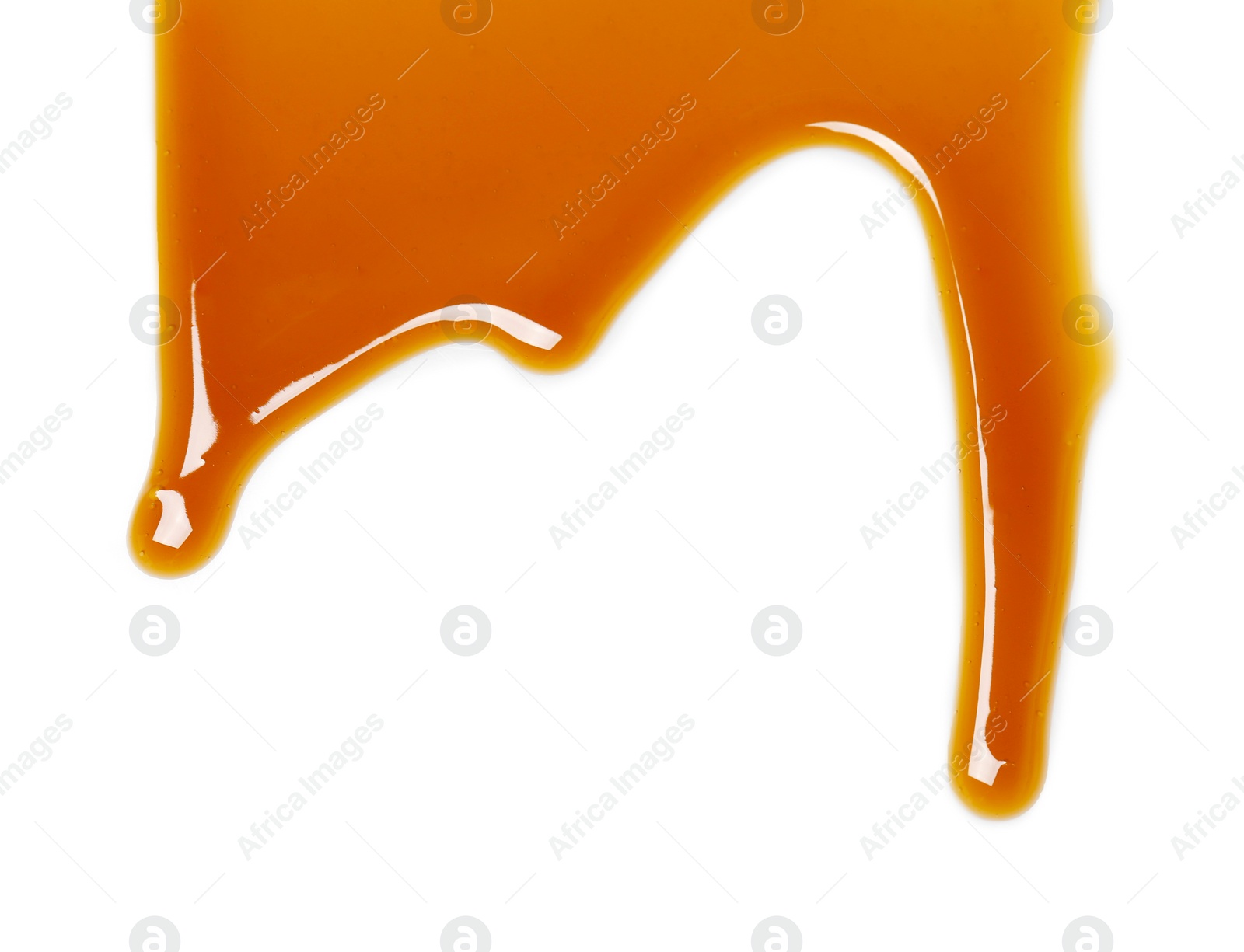 Photo of Delicious caramel sauce on white background