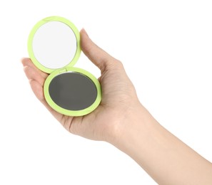 Photo of Woman holding green cosmetic pocket mirror on white background, closeup