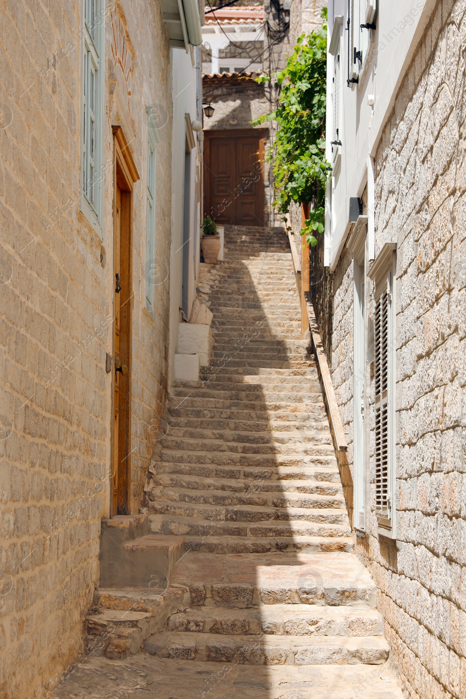 Photo of Stone stairs between buildings on sunny day