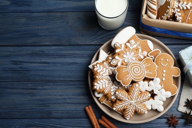 Photo of Delicious Christmas cookies on blue wooden table, flat lay. Space for text